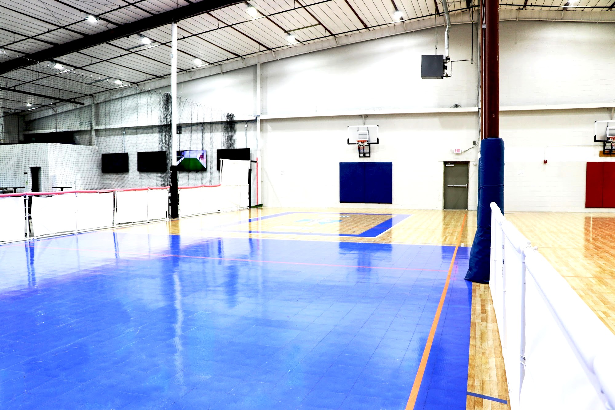 Bright blue and wood indoor hard court used for Parents' Night Out evenings